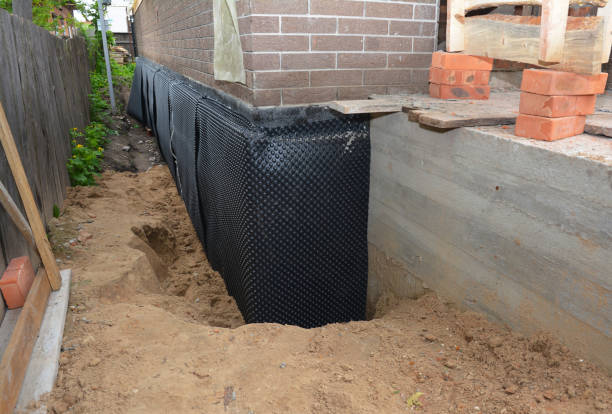 Happy homeowners after waterproofing job in Sedgwick